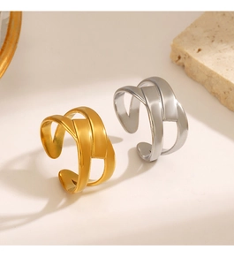Detailed shot of criss-cross woven titanium steel rings in gold and silver finish