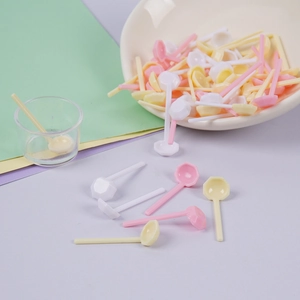 Mini plastic spoons for dollhouse accessories in macaron pink, yellow, and white colors