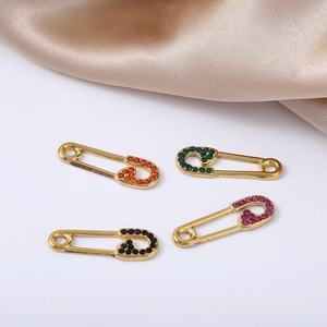 Elegant gold stainless steel pins set with colorful rhinestones in four vibrant shades
