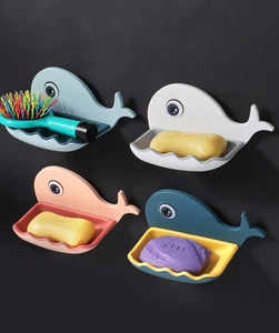 Detail of whale-shaped wall-mounted soap dish with wave drainage tray in four colors