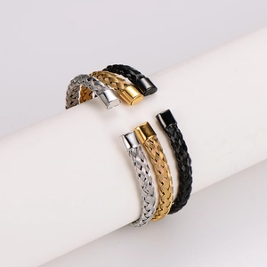 Three minimalist woven cable C-shaped cuff bracelets in silver, gold, and black finishes