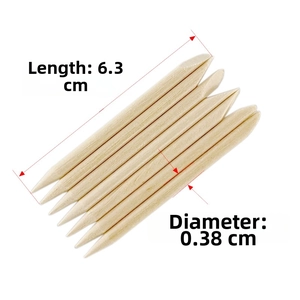 Detail view of dual-ended orange wood nail sticks with 6.3cm length and 0.38cm diameter