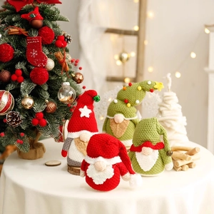 Handcrafted Nordic Christmas gnome dolls in red and green for festive home table decoration