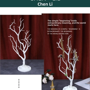 Detailed comparison of white branch jewelry rack empty and with necklaces and earrings