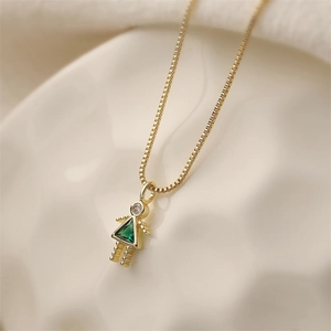 Golden necklace featuring a cute mini girl pendant with a green triangle gemstone and zircon