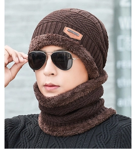 Close-up of coffee brown knitted beanie and neck warmer set with thick fleece lining texture