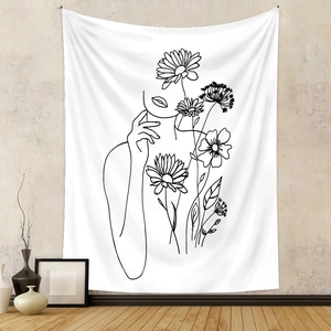 Detail view of modern minimalist line art tapestry featuring floral and female silhouettes