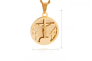 Detailed close-up of 18K gold-plated religious pendant with crucifix and prayer engraving