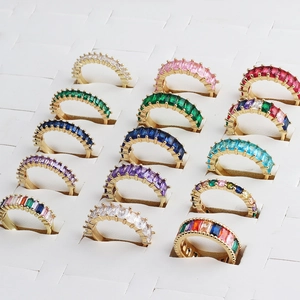 Golden open rings with rectangular multicolor zircon stones in a neat matrix layout