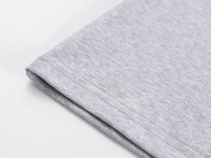 Detailed close-up showing the professional stitching and texture of grey knitted fabric