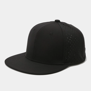Detail of laser-cut ventilation eyelets on a black flat-brim snapback baseball cap