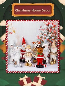 Close-up of plush Santa and reindeer Christmas figurines with sequined details