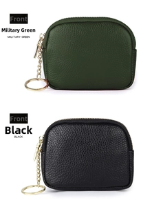 Close-up of pebble grain leather coin purses with gold zippers and keychains