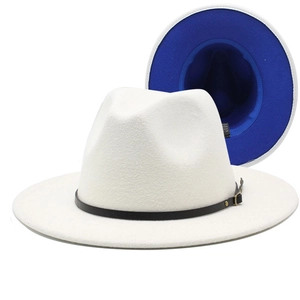 Detail of white wool fedora hat featuring black leather belt and vibrant royal blue underbrim