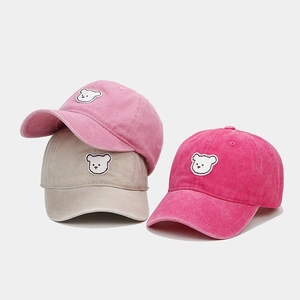 Three washed cotton baseball caps in pink and grey colors with cute bear embroidery detail