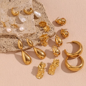 Macro view of vintage 18K gold plated steel earrings with drop and rectangle designs
