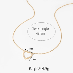 Detail view of gold heart pendant with white zircon showing chain length and weight info