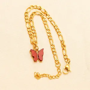 Elegant 18K gold Figaro chain anklet featuring a vibrant red butterfly pendant for women