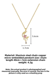 Macro shot of titanium steel moon tassel necklace with pink heart gem and dimensions