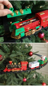 Detail of Christmas tree train battery compartment and engine running on hanging tracks