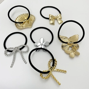 Set of 6 elastic hair ties with gold and silver metal bow and shell charms