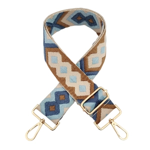 Detail of adjustable 5cm blue diamond jacquard shoulder strap with gold metal hardware