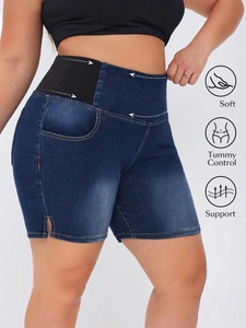Detail view of denim shorts showing tummy control waistband, soft fabric, and support features
