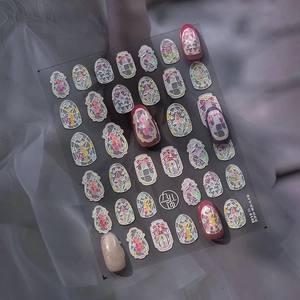 Detail of Rococo shell luster nail stickers with vintage stained glass patterns