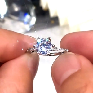 Macro shot of a classic six-prong diamond engagement ring with micro-pave band detail