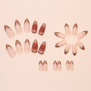 Almond shaped press-on nails with caramel French metallic tips and cat eye gradient effect