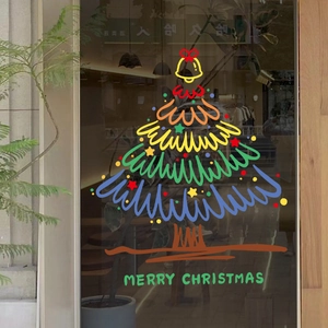 Large colorful Christmas tree window decal with Merry Christmas text on glass