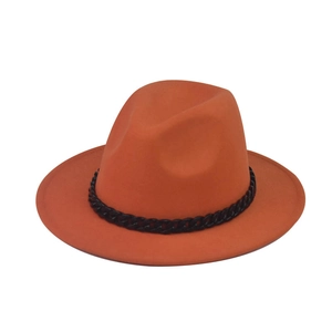 Detail of an orange wool fedora featuring a decorative thick glossy black chain trim