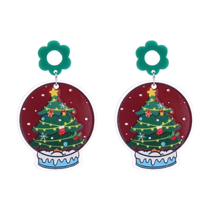 Detail of Christmas tree acrylic earrings with snowflake globe design and glitter finish