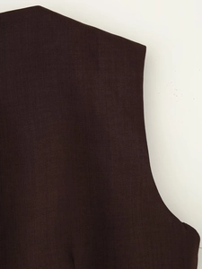 Detailed macro view of dark brown twill fabric showing high-quality textile texture