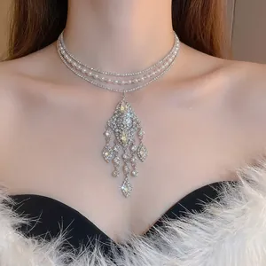 Luxurious layered choker with pearls, rhinestones, and elegant crystal fringe tassel