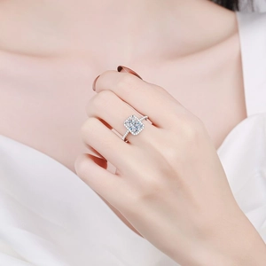 Elegant 925 sterling silver ring with square halo moissanite worn on a model hand