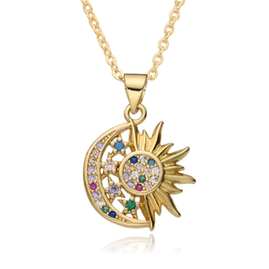 Detailed close-up of golden sun and moon pendant inlaid with colorful zircon stones