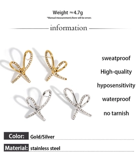 Detail showing weight and hypoallergenic material of bow earrings with zircons