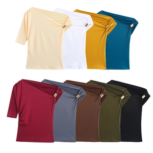 Detail view of one-shoulder shirts showing metal ring detail and nine color options