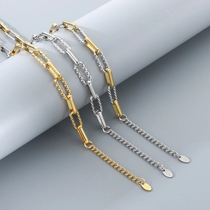 Detailed view of silver and gold stainless steel paperclip chain bracelets with HIF tags