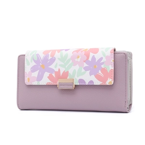 Close-up of taro purple long wallet with floral print flap and textured lychee leather