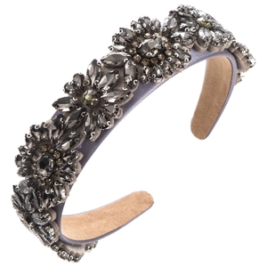 Detailed macro view of wide headband featuring grey-purple satin and sparkling rhinestones