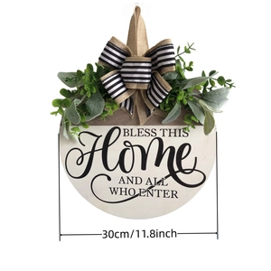 30cm wooden welcome sign for front door with Bless This Home message and greenery