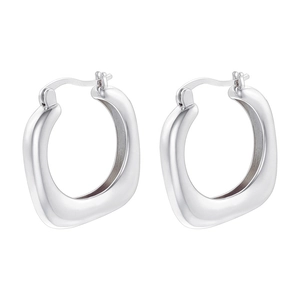 Macro detail of silver geometric U-shaped hoop earrings with a polished mirror finish
