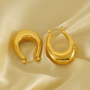Polished 18K gold-plated chunky teardrop hoop earrings on champagne silk background