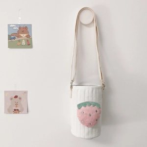 Quilted white water bottle bag featuring a plush strawberry applique and shoulder strap