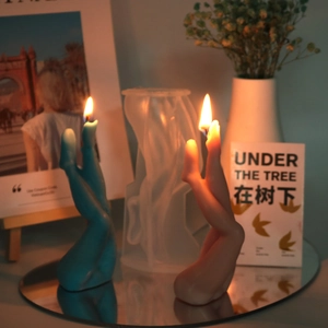 Detailed view of leg-shaped scented candles and the silicone resin mold for DIY art