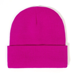 Detailed close-up of rose red knitted beanie showing thick textured fabric and ribbed cuff