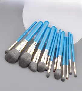 Close-up of 13-piece peacock blue makeup brush set with soft grey synthetic bristles