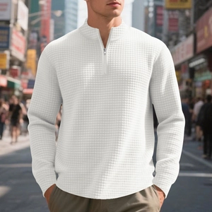 Detail shot of the waffle texture fabric on this white men's quarter-zip sweatshirt